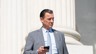 New Jersey Congressman Tom Suozzi stands on the steps of the U.S. Capitol.