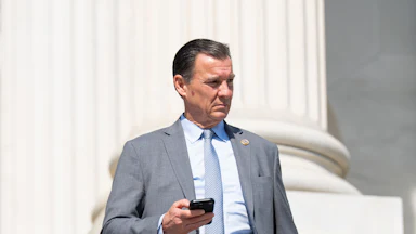 New Jersey Congressman Tom Suozzi stands on the steps of the U.S. Capitol.
