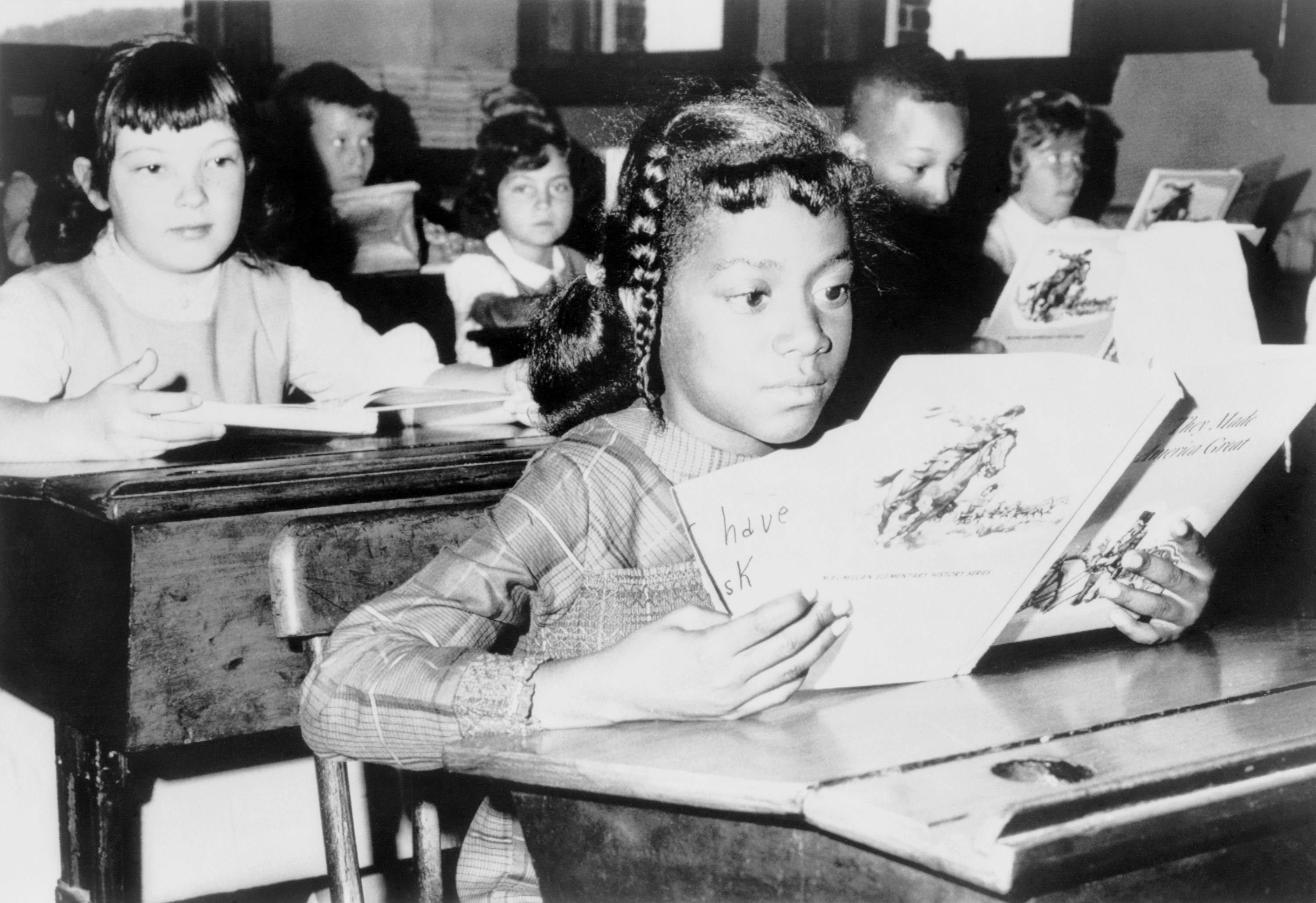 A child from Roxbury, in Boston, attending school as part of the desegregation effort "Operation Exodus" in 1965.