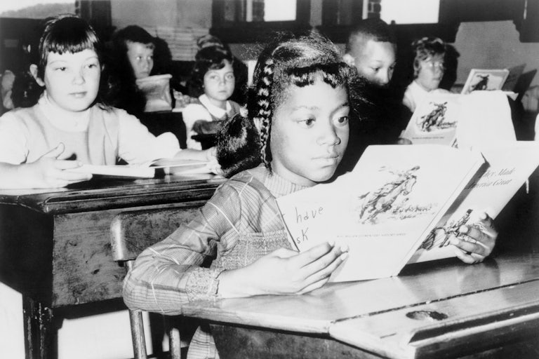 A child from Roxbury, in Boston, attending school as part of the desegregation effort "Operation Exodus" in 1965.