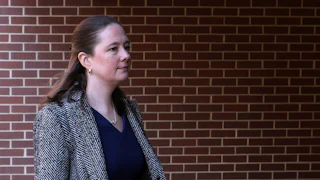 Maurene Comey walks outside a courthouse