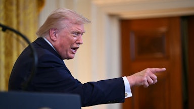 Donald Trump points and speaks