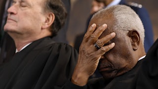 Supreme Court Associate Justice Clarence Thomas covers his face as he waits for the opportunity to leave the stage at the conclusion of Trump’s second inauguration ceremonies.