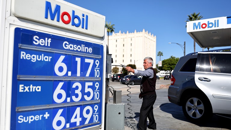 A Mobil sign displays gas prices over $6 a gallon in Los Angeles.
