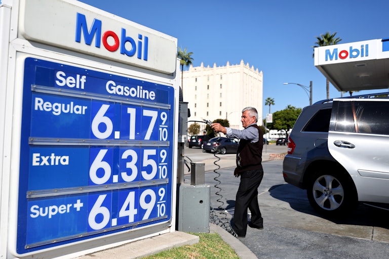 A Mobil sign displays gas prices over $6 a gallon in Los Angeles.