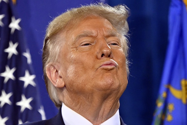 Donald Trump blows a kiss