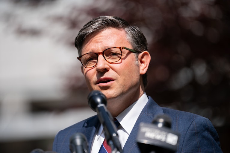 Mike Johnson speaks at a mic