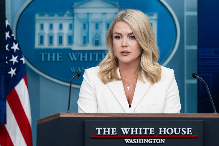 White House Press Secretary Karoline Leavitt speaks at a podium during a briefing