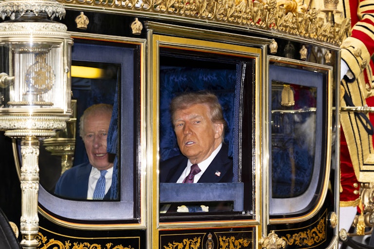 Donald Trump and King Charles ride in a carriage