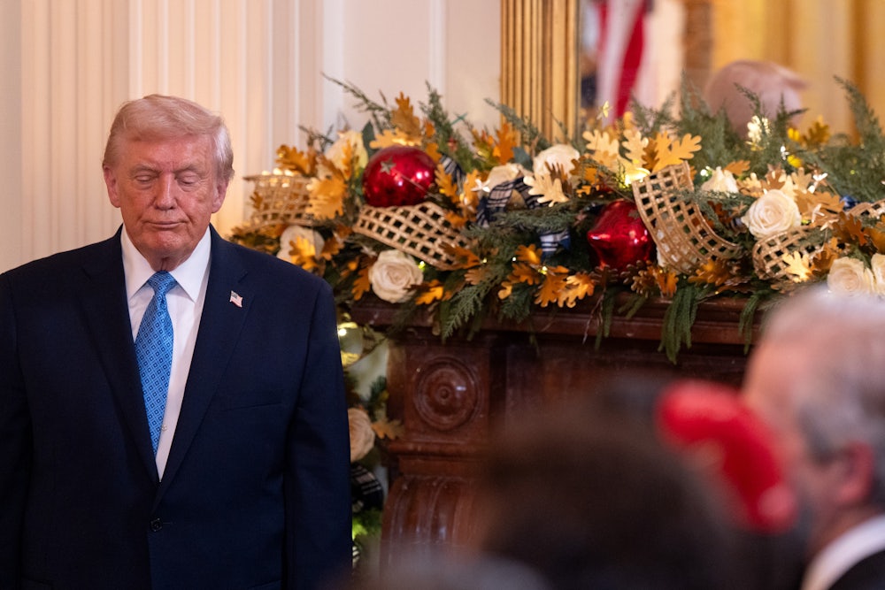 Donald Trump looks on during a Hanukkah reception at the White House.