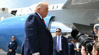 Donald Trump speaks to reporters after exiting Air Force One