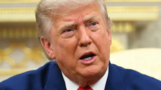 Donald Trump stares while speaking