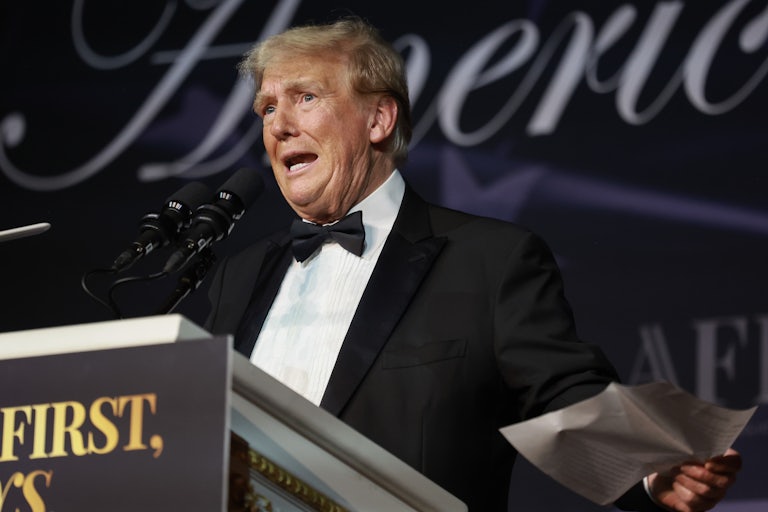 Donald Trump gestures and speaks
