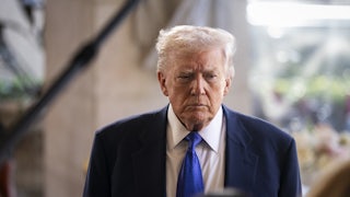 Donald Trump looks down, frowning