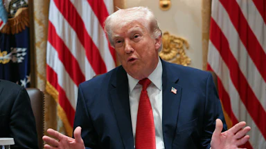 President Donald Trump splays his hands out while speaking at a Cabinet meeting.