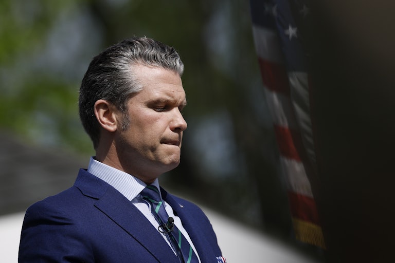 Pete Hegseth looks down while speaking to the U.S. Army War College