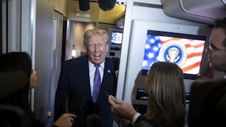 Donald Trump speaks to reporters on Air Force One