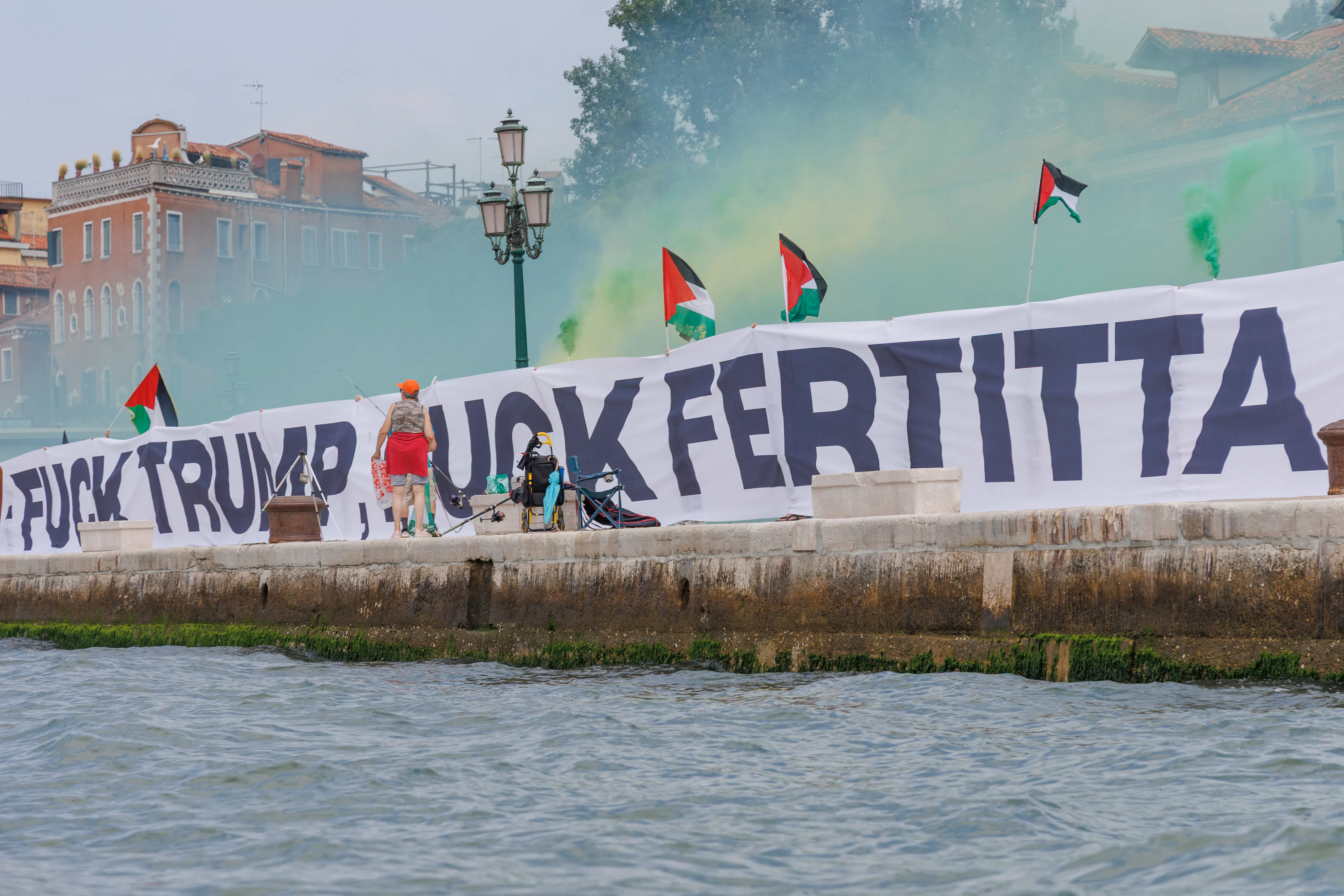 A sign that reads "Fuck Trump Fuck Fertitta" and lots of Palestinian flags.
