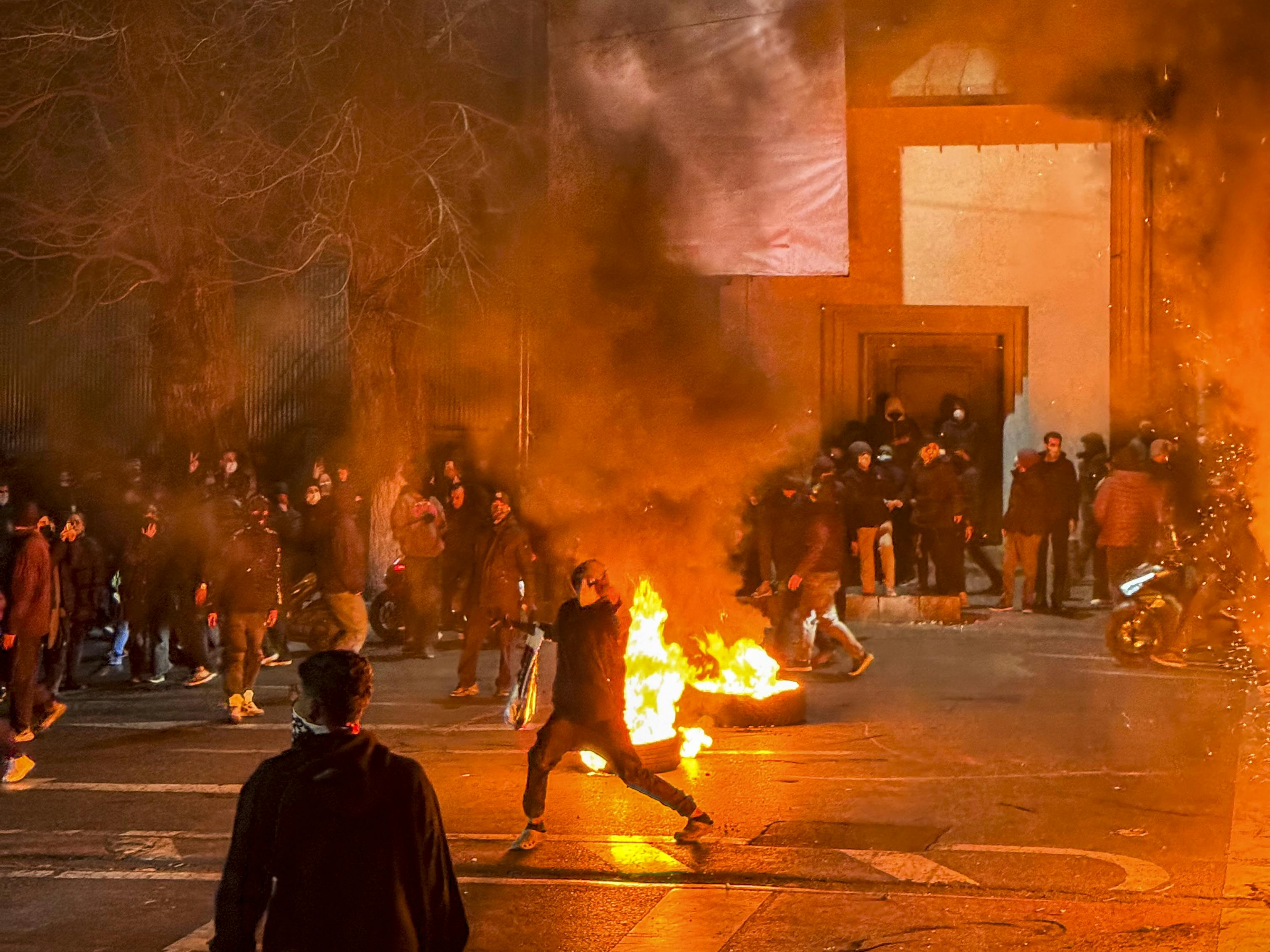 People gather during a protest in Tehran