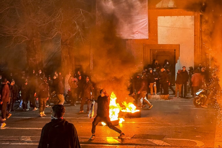 People gather during a protest in Tehran