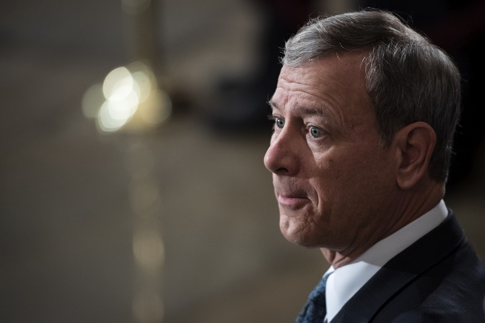 John Roberts waits patiently in the Capitol Rotunda