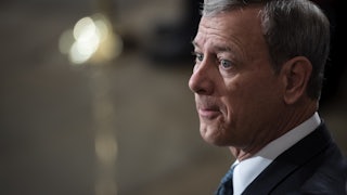John Roberts waits patiently in the Capitol Rotunda