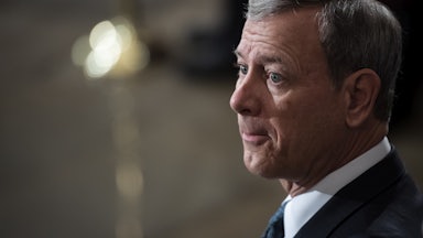 John Roberts waits patiently in the Capitol Rotunda