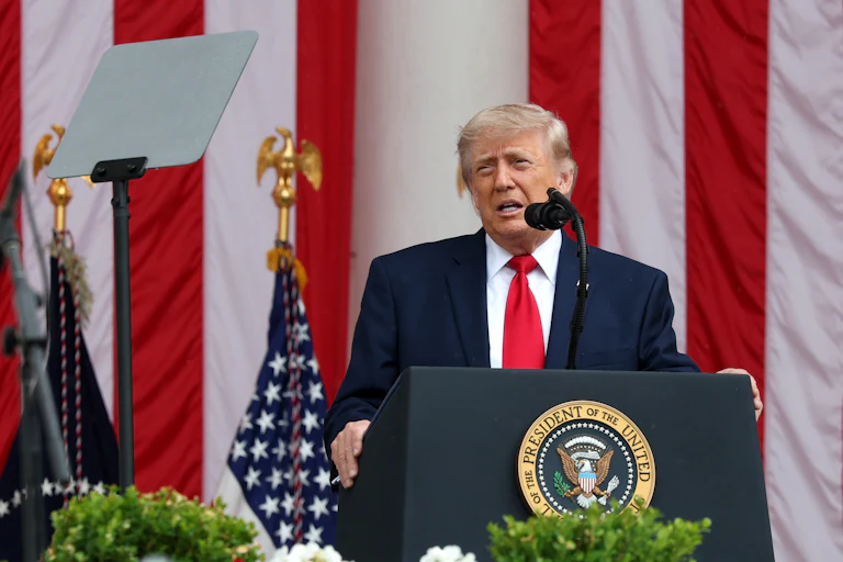 Donald Trump speaking at a podium