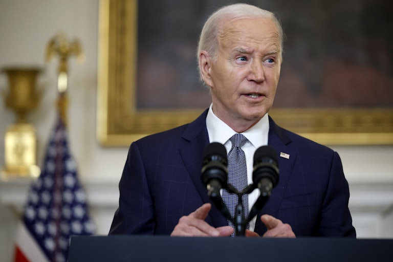 President Joe Biden speaks at a podium