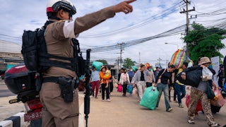 Cambodian nationals at the Ban Khlong Luek border crossing on December 11, 2025, as clashes between Thailand and Cambodia continue.