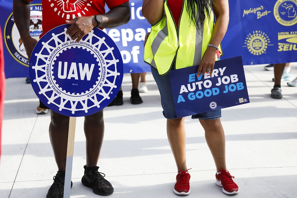 United Auto Workers members and others gather for a rally after marching in the Detroit Labor Day Parade.