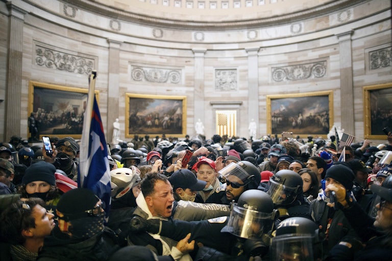 Donald Trump supporters fight with police officers in the U.S. Capitol Building on January 6, 2021