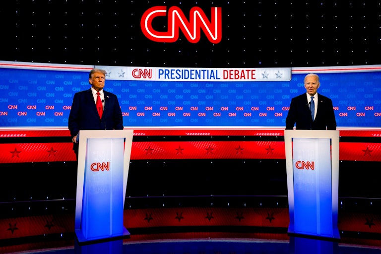 Donald Trump and Joe Biden stand at podiums
