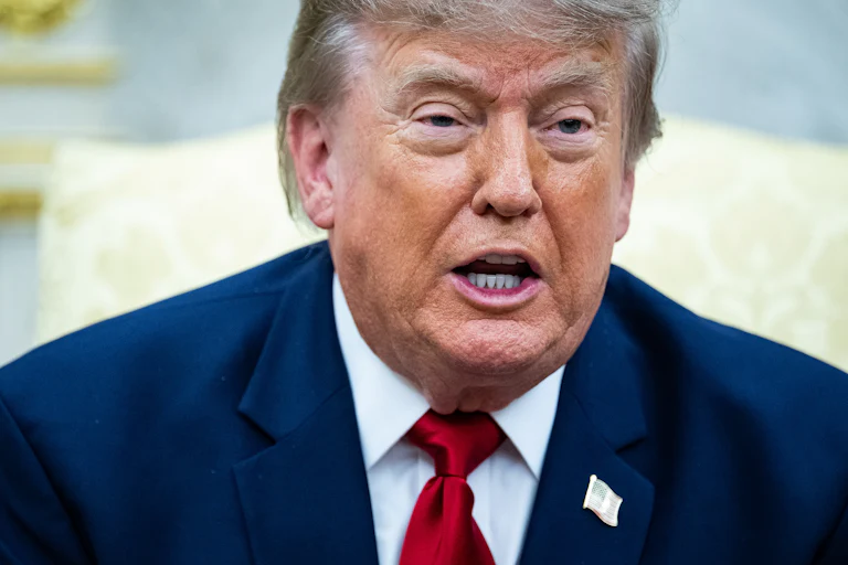 Donald Trump speaks while sitting in the Oval Office.