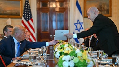 Benjamin Netanyahu handed a letter to Donald Trump during a meeting at the White House on July 7.