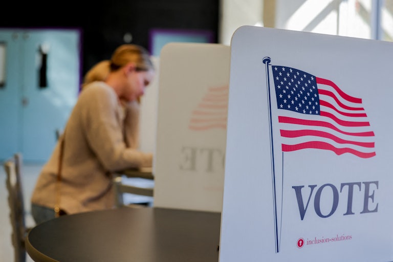 A person votes at a polling station
