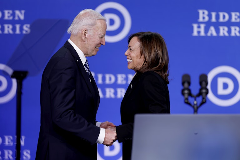 President Biden and Vice President Harris onstage during the Democratic National Committee winter meeting