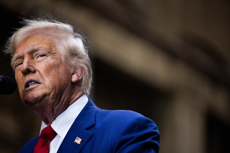 Image of Donald Trump making a weird face while speaking (and his spray tan looks really bad)