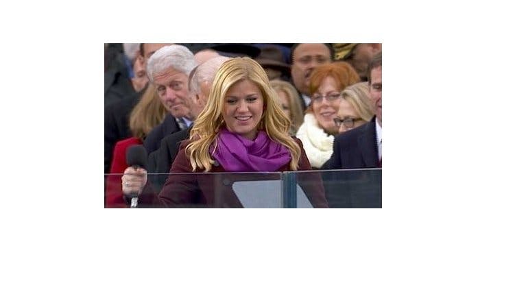 Former president Bill Clinton rubbernecks to check out Kelly Clarkson at the inauguration this year. (Brooklyn Spoke/Twitter)