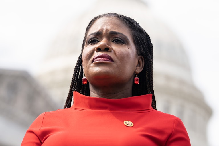 Representative Cori Bush stands in front of the U.S. Capitol