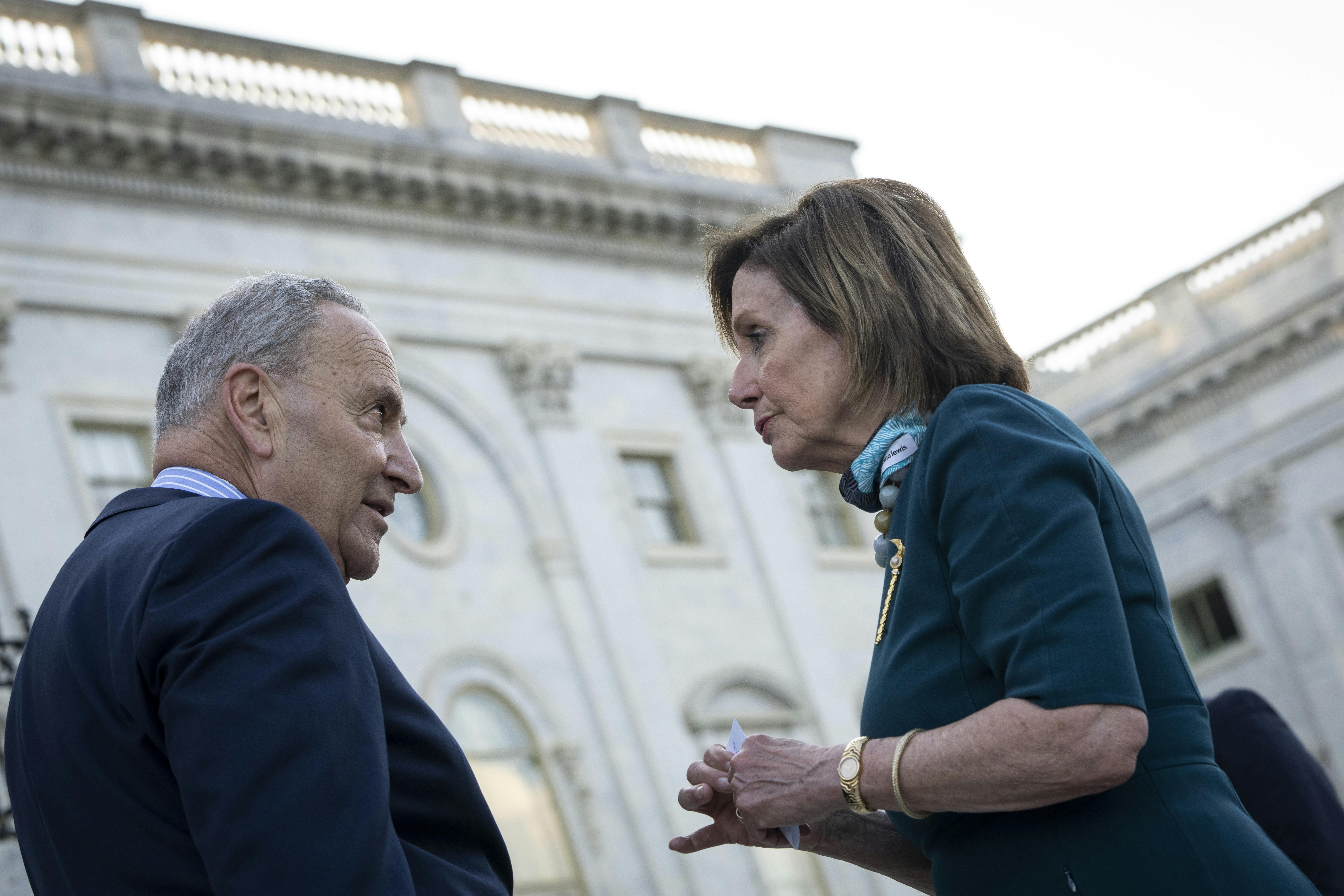 Chuck Schumer and Nancy Pelosi have a heated discussion on the steps of the U.S. Capitol.