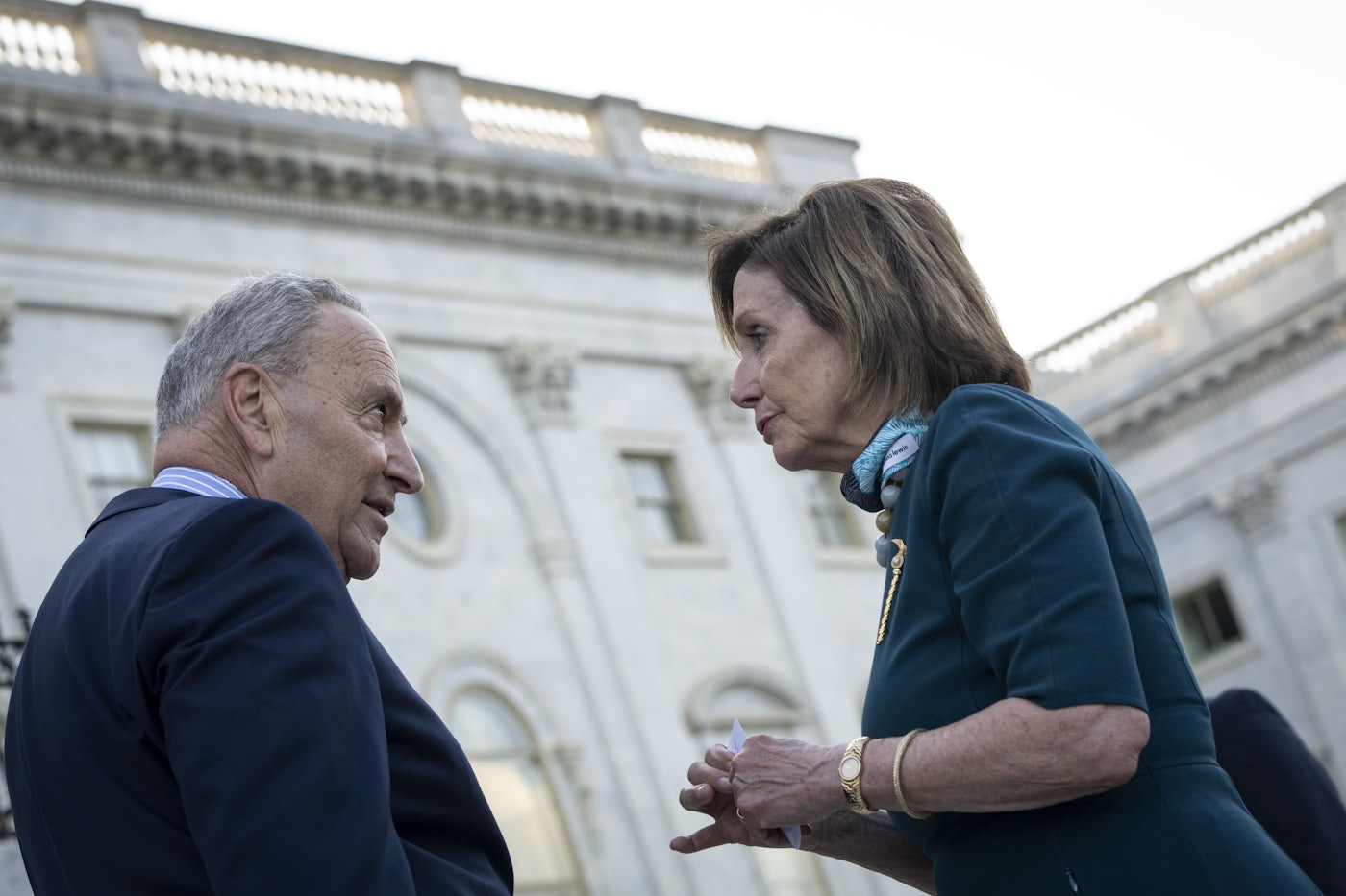 Chuck Schumer and Nancy Pelosi have a heated discussion on the steps of the U.S. Capitol.