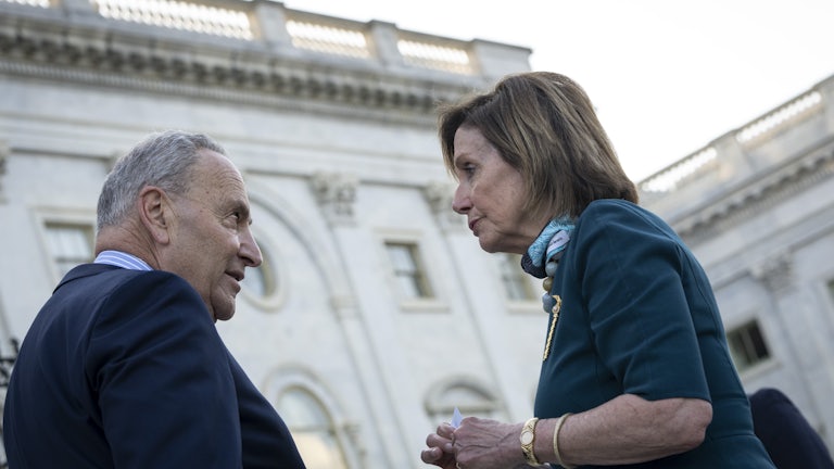 Chuck Schumer and Nancy Pelosi have a heated discussion on the steps of the U.S. Capitol.