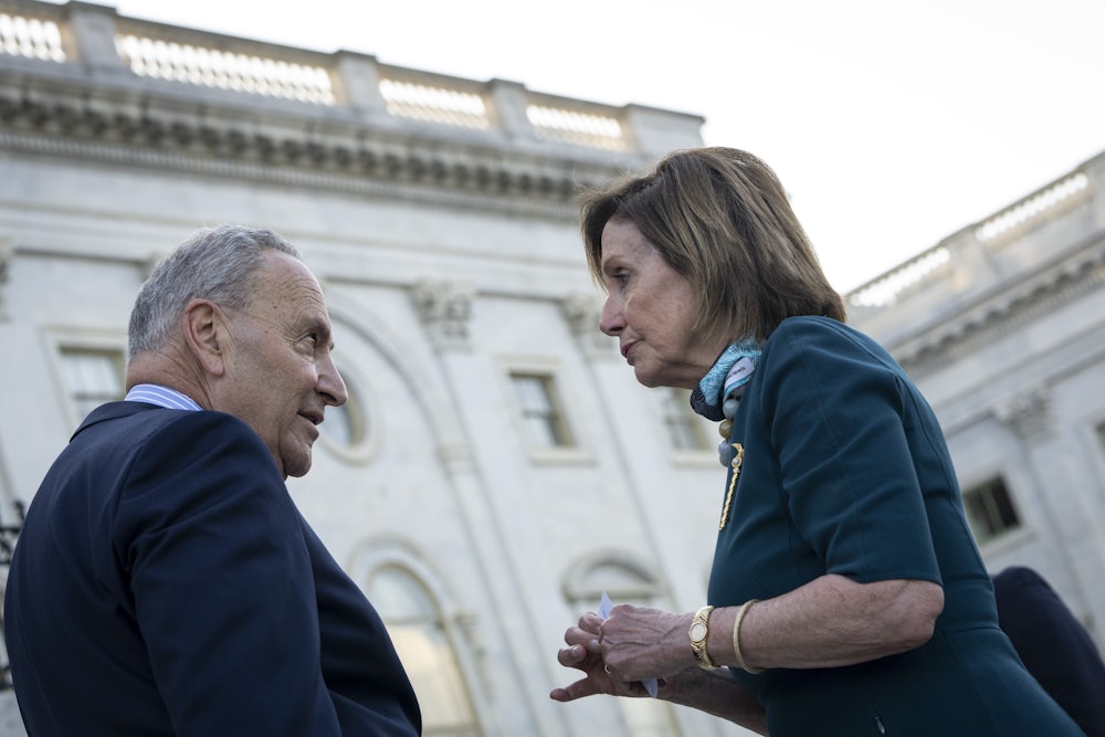 Chuck Schumer and Nancy Pelosi have a heated discussion on the steps of the U.S. Capitol.