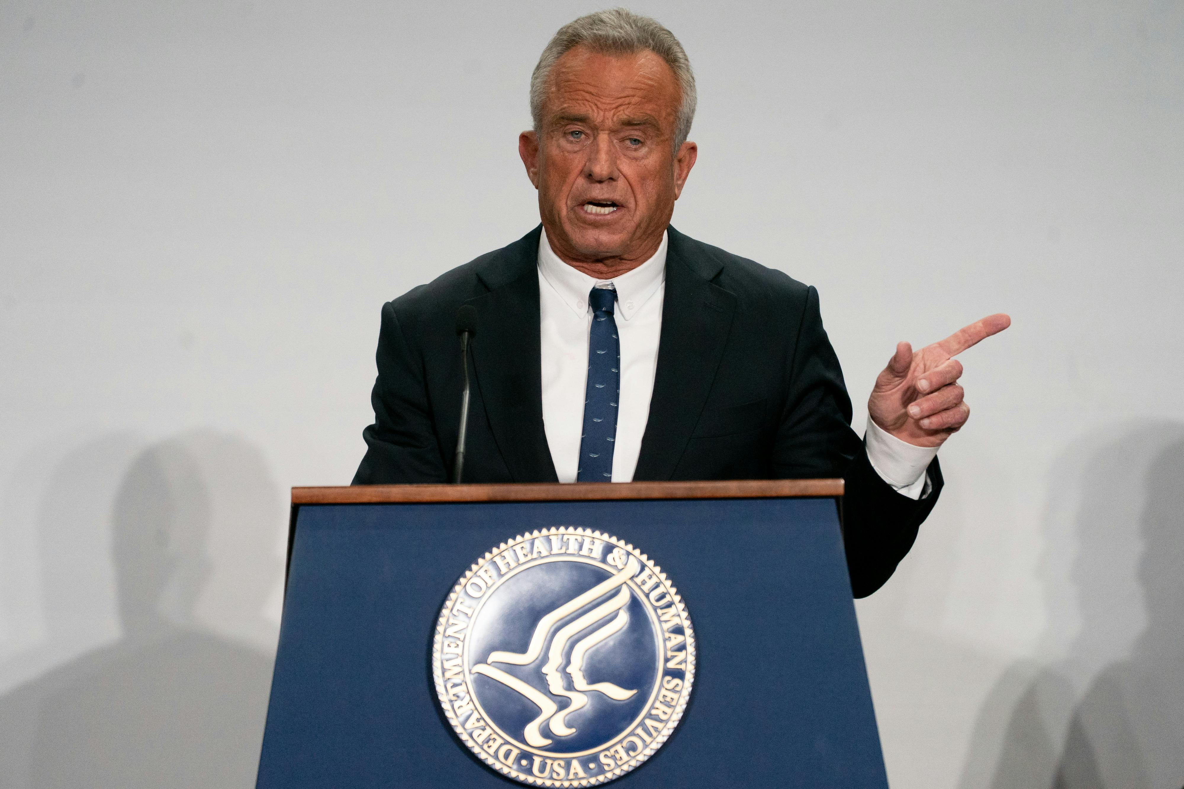 Health and Human Services Robert F. Kennedy Jr. points to the side while speaking at a podium