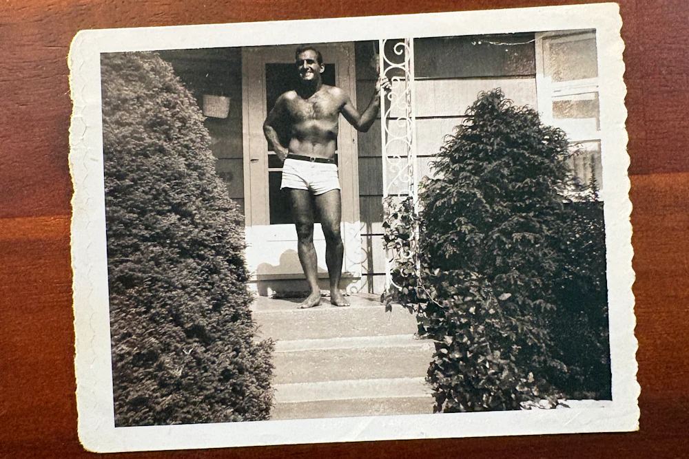 A photograph of Tom Junod’s father, Lou, on the steps of their home in Wantagh, New York, in the early 1960s. Lou wanted this photograph to be shown at his funeral, so mourners would remember him in his “prime".