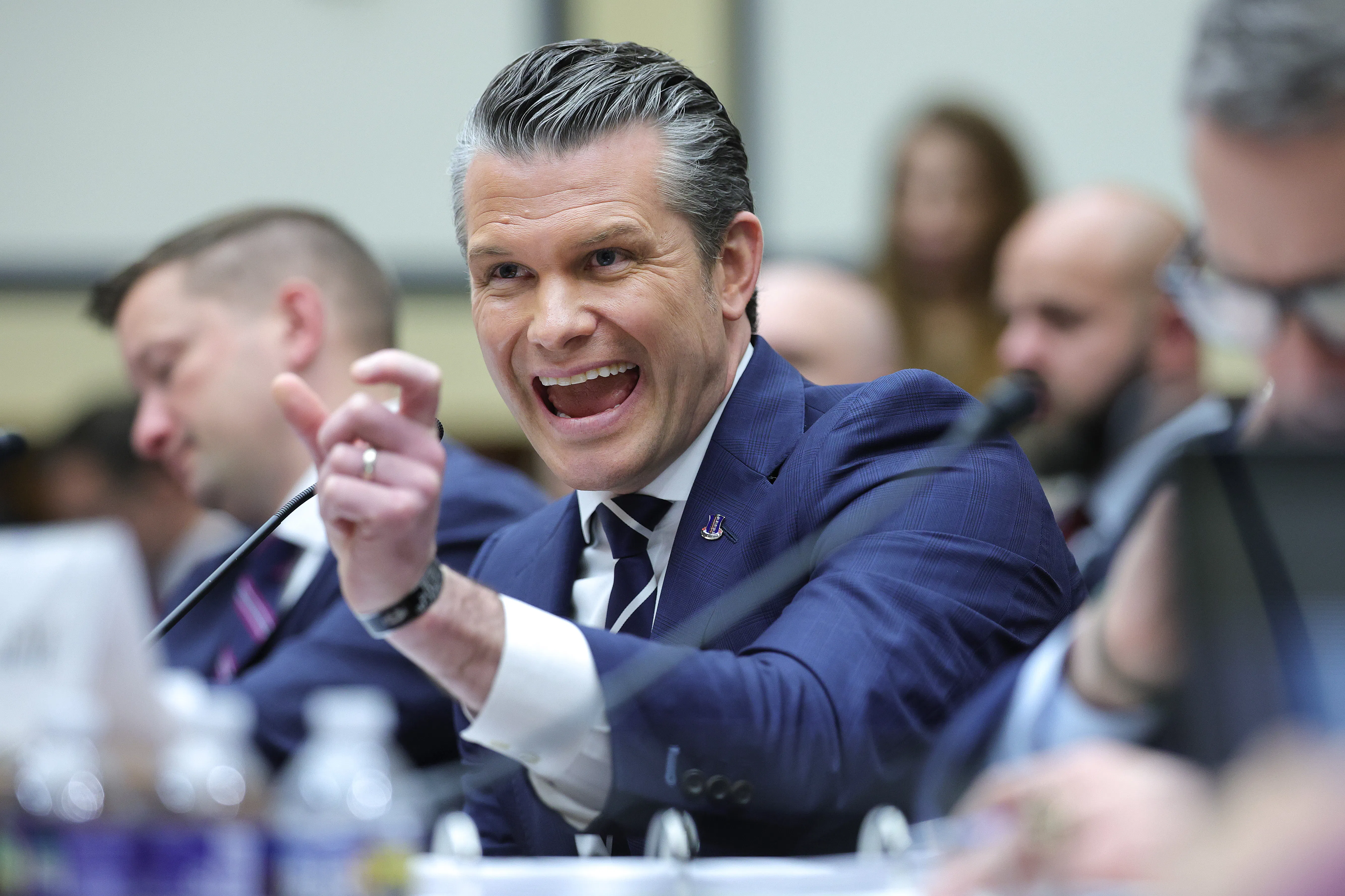 Defense Secretary Pete Hegseth gestures and speaks during a House committee hearing