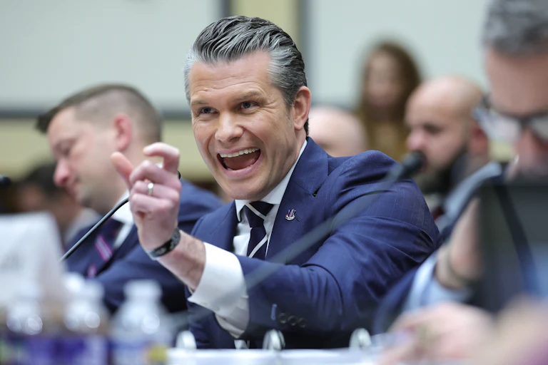 Defense Secretary Pete Hegseth gestures and speaks during a House committee hearing