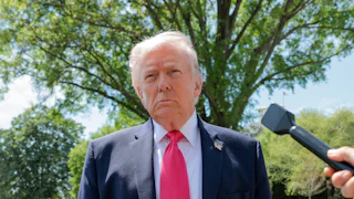 Donald Trump speaks with reporters outside the White House