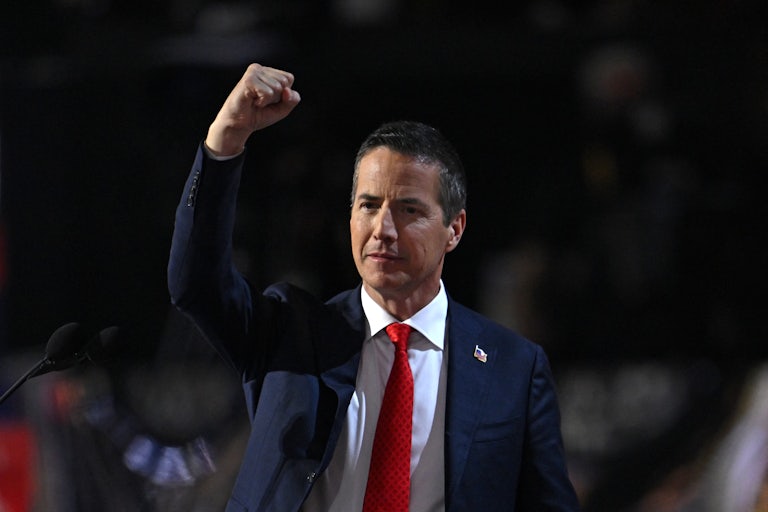 Bernie Moreno raises his fist while onstage at the Republican National Convention
